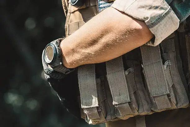 Male soldier wearing a vest.