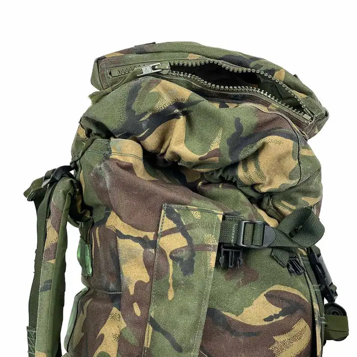 Close-up of the top section of a British Army camo rucksack with a zippered lid and compression straps.