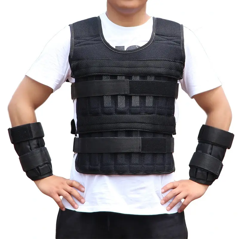 Person wearing a black weighted vest with adjustable straps and wrist weights over a white shirt.