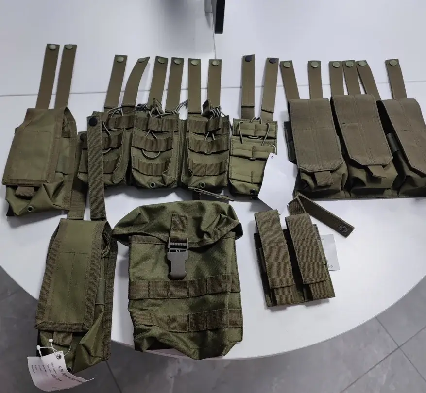 Assorted green MOLLE tactical pouches