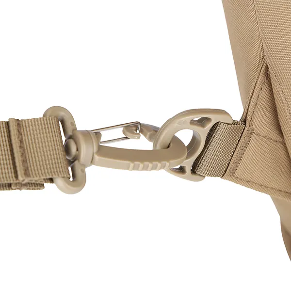 Close-up of a tan backpack strap with a plastic buckle connection.