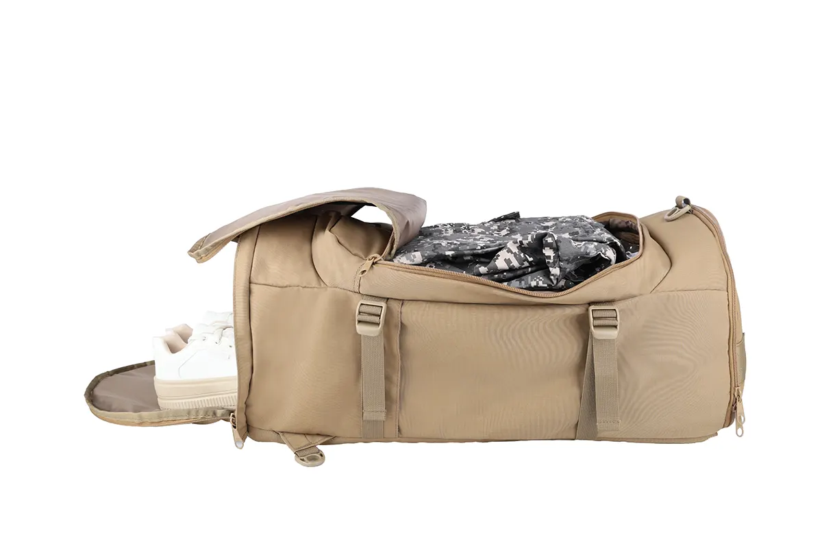 Open tan cylindrical backpack with a white shoe and camouflage clothing inside