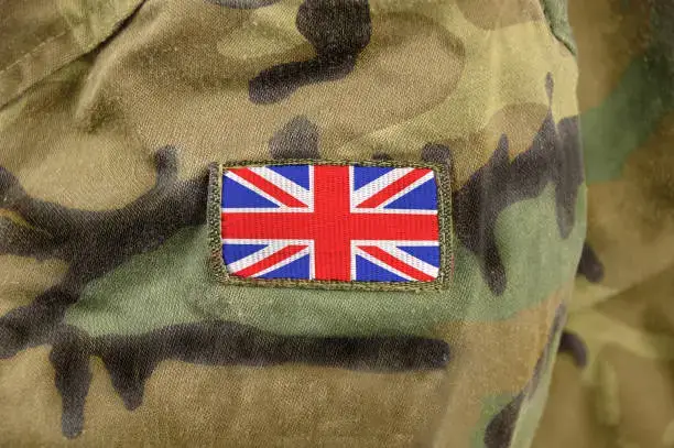 a UK flag on a soldier's uniform